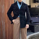 Hunting jacket with notched collar and four button flap pockets