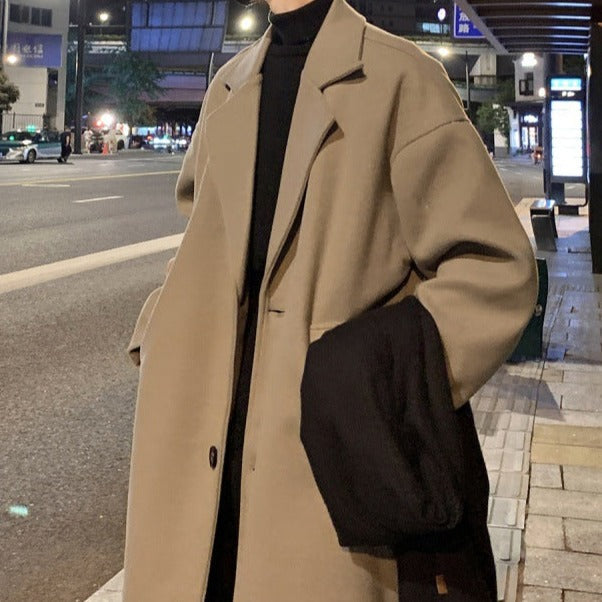 Longline belted overcoat with notched lapels and side pockets
