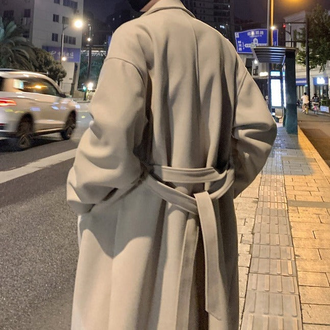 Longline belted overcoat with notched lapels and side pockets