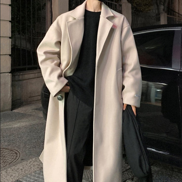 Longline belted overcoat with notched lapels and side pockets