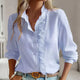 Women's ruffled button-front blouse with stand collar and long sleeves