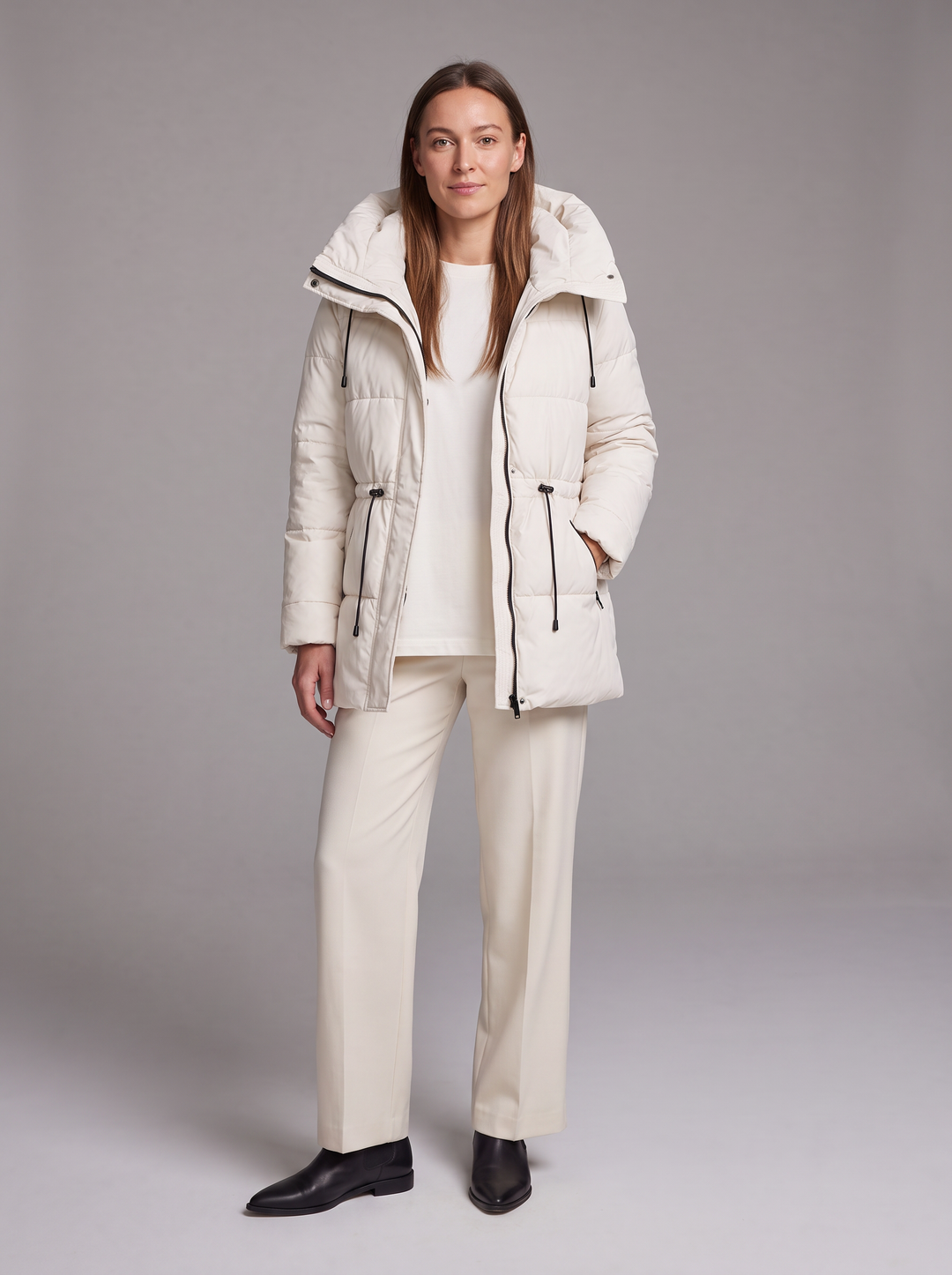 Women's padded hooded parka coat shown in beige and black