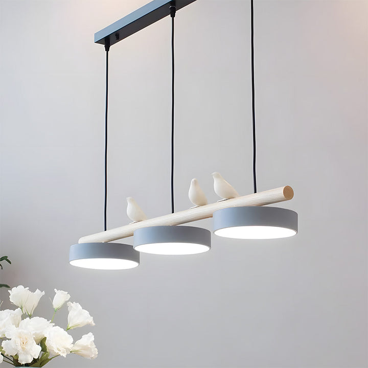 Three-lamp LED pendant light with wood-effect bar and bird details