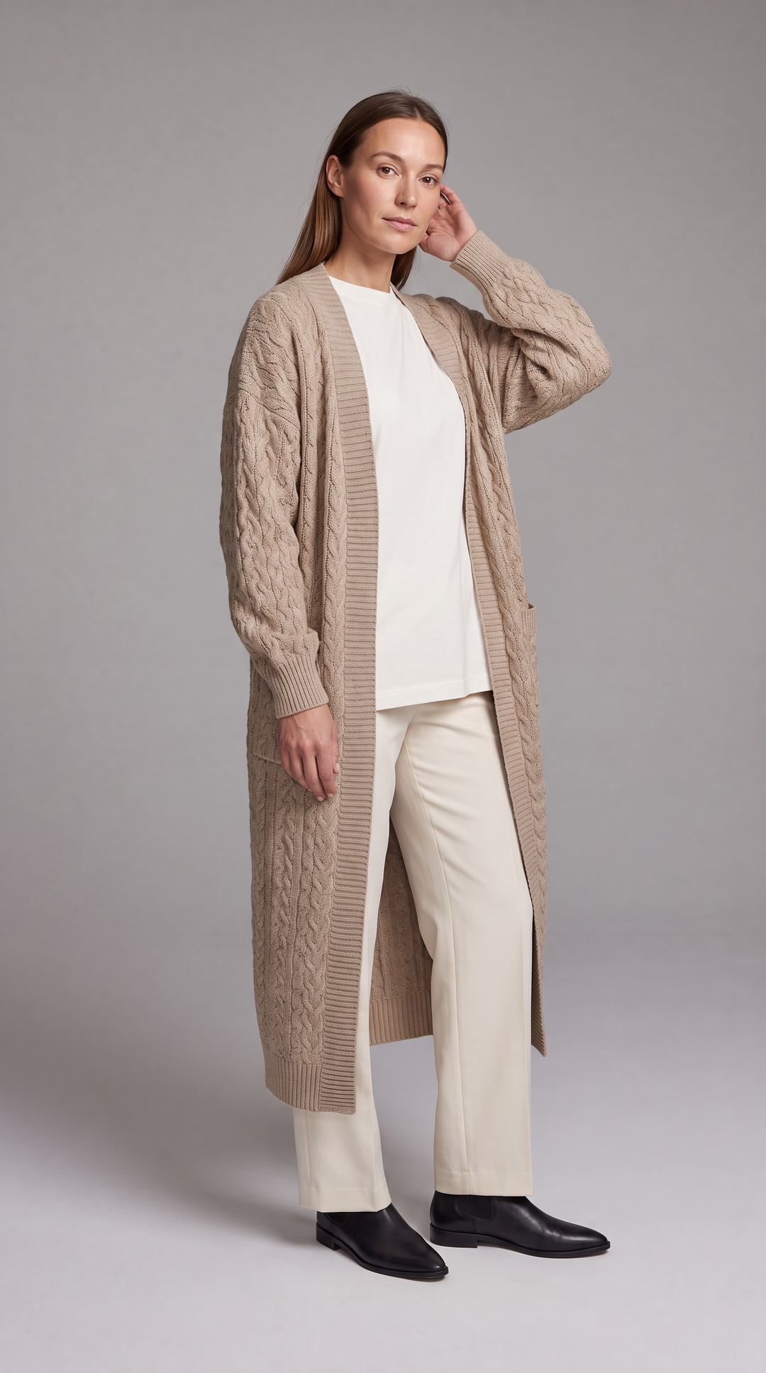 Women's longline textured knit cardigan shown in black and beige with open front and long sleeves