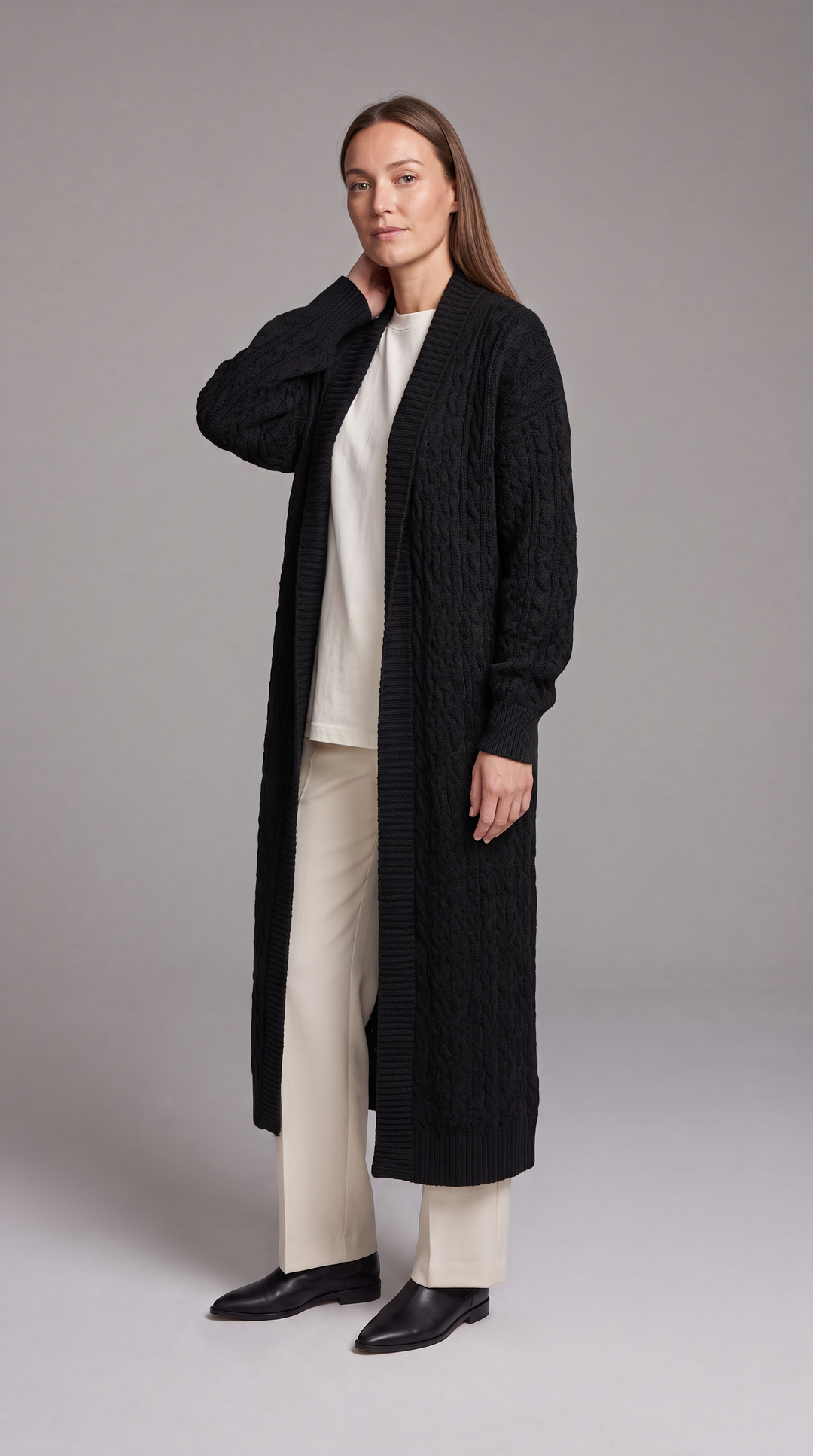 Women's longline textured knit cardigan shown in black and beige with open front and long sleeves