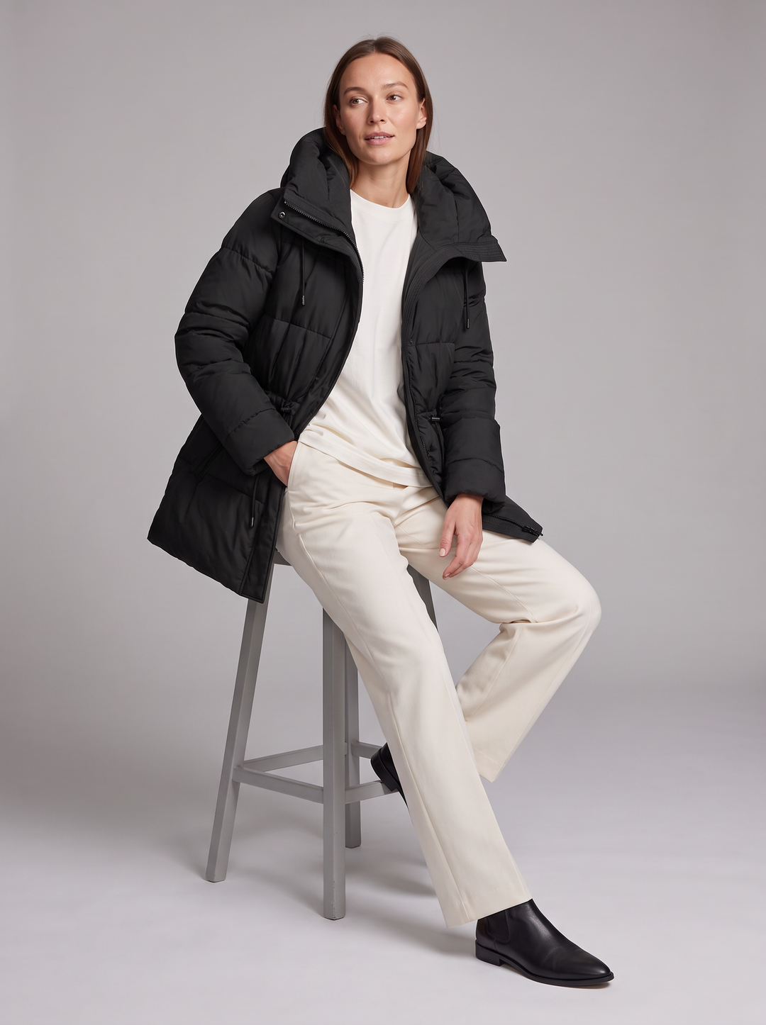 Women's padded hooded parka coat shown in beige and black