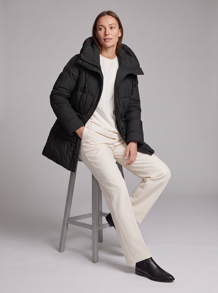 Women's padded hooded parka coat shown in beige and black