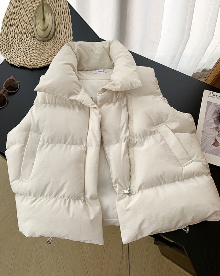 Sleeveless quilted puffer vest with stand collar, front zipper and side pockets