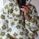 Women's floral fleece sweatshirt with hood, half-zip front and large kangaroo pocket