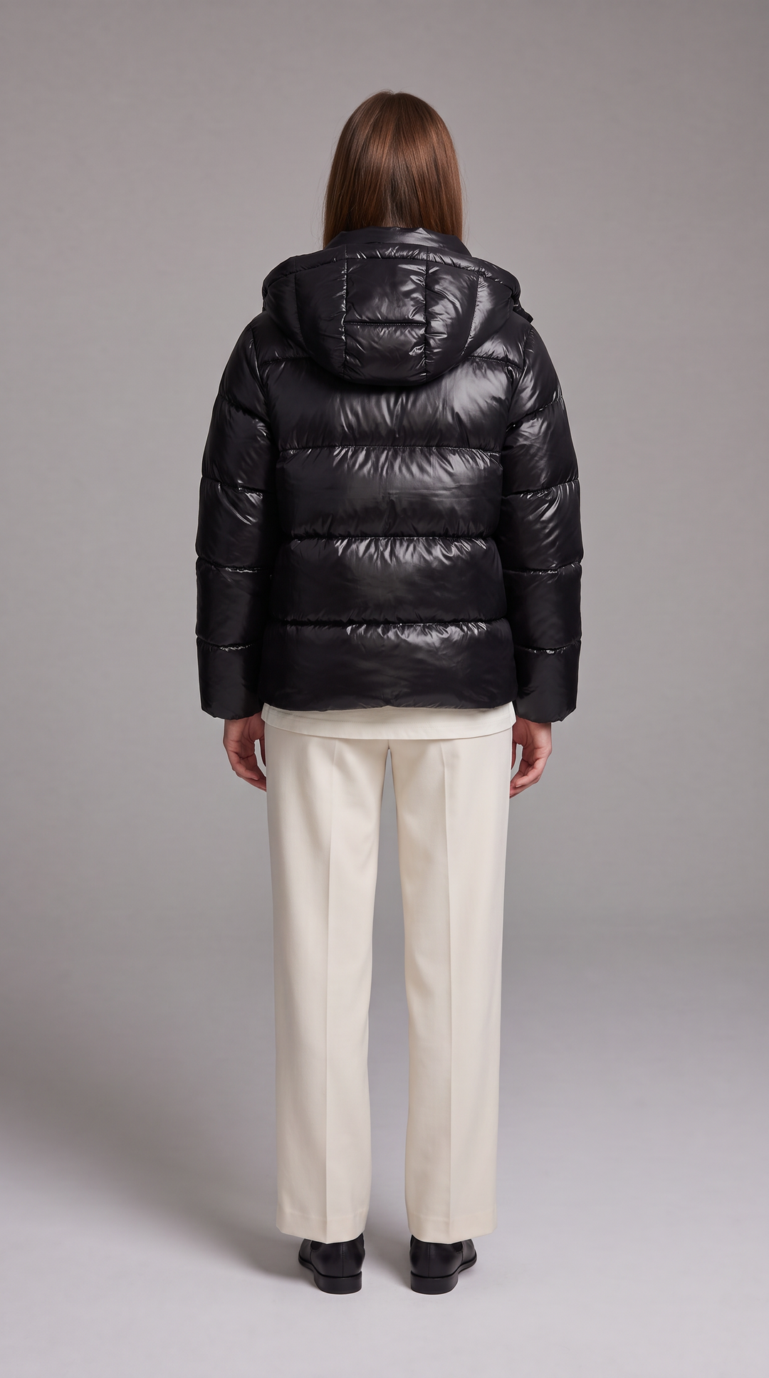Women's hooded quilted puffer coat with long sleeves and zip front