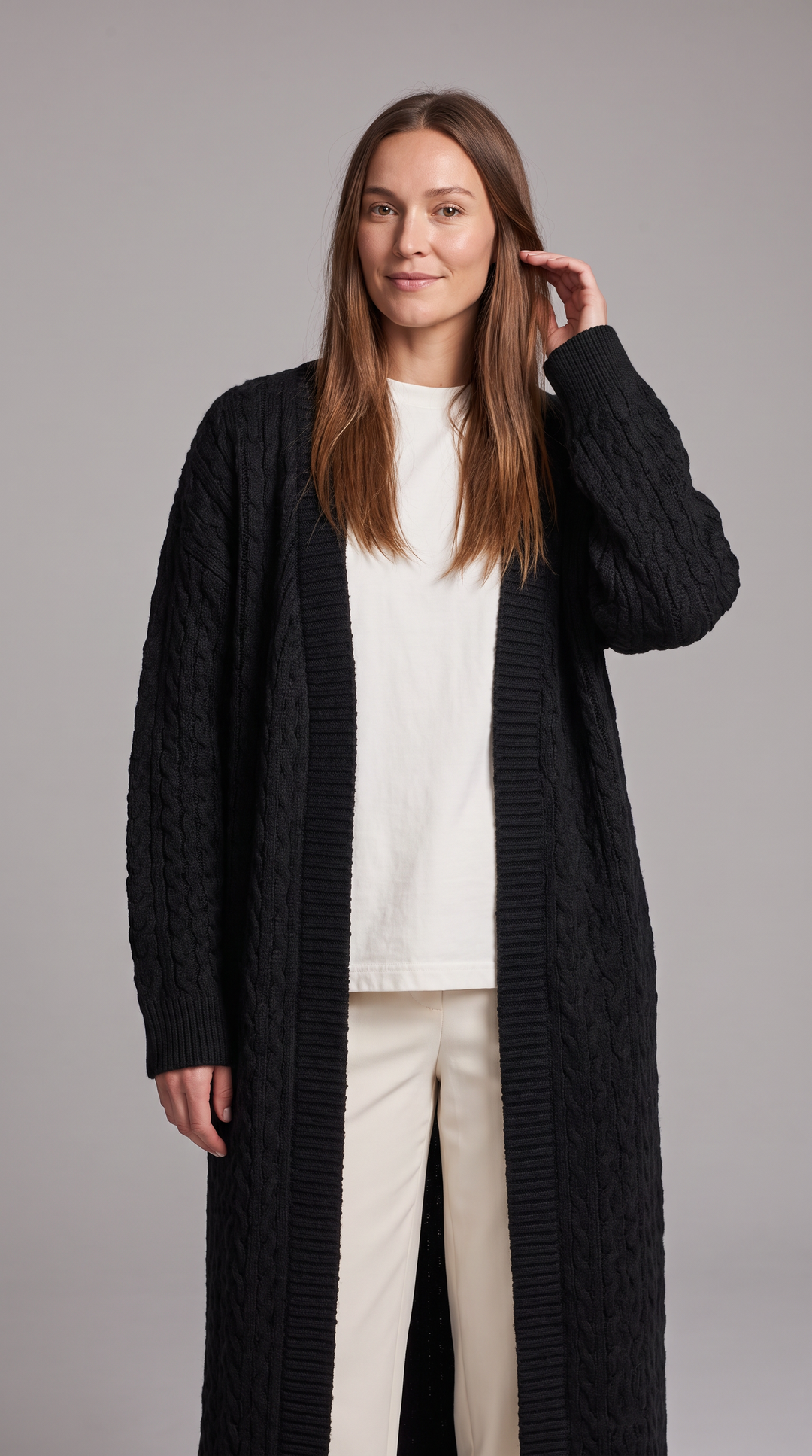 Women's longline textured knit cardigan shown in black and beige with open front and long sleeves