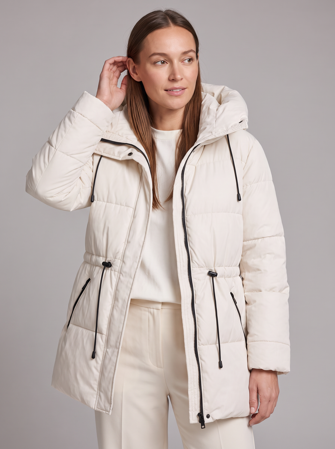 Women's padded hooded parka coat shown in beige and black