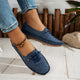 Women's low-profile lace-up moccasin shoes with stitched trim and flat textured soles
