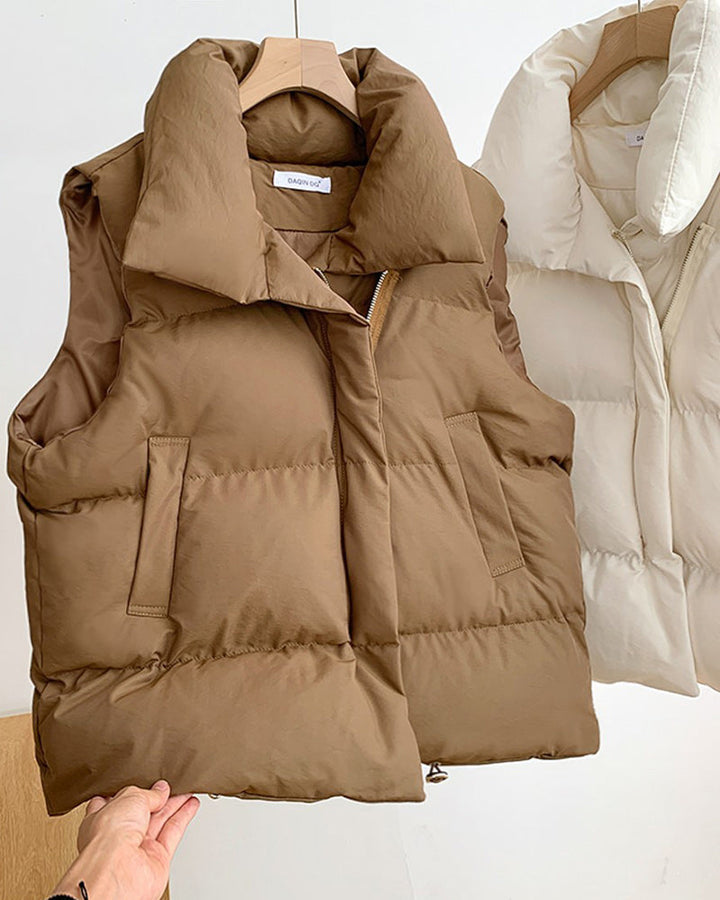 Sleeveless quilted puffer vest with stand collar, front zipper and side pockets