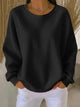 Women's textured crew neck sweater with long sleeves and ribbed cuffs