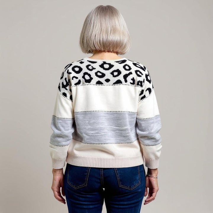 Women's leopard print color block sweater with crew neckline and long sleeves