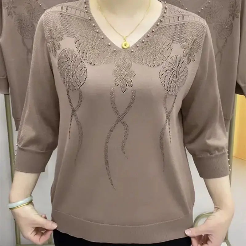V-neck jersey top with floral embellishment and three-quarter sleeves