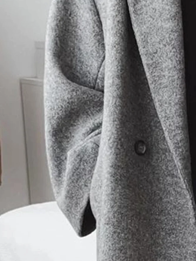 Women's long double-breasted coat with notched lapels