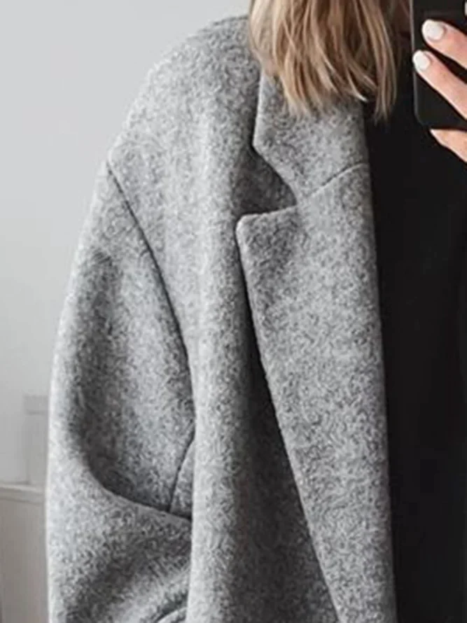 Women's long double-breasted coat with notched lapels