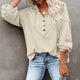 Women's loose V-neck button hoodie with drawcord hood and long sleeves