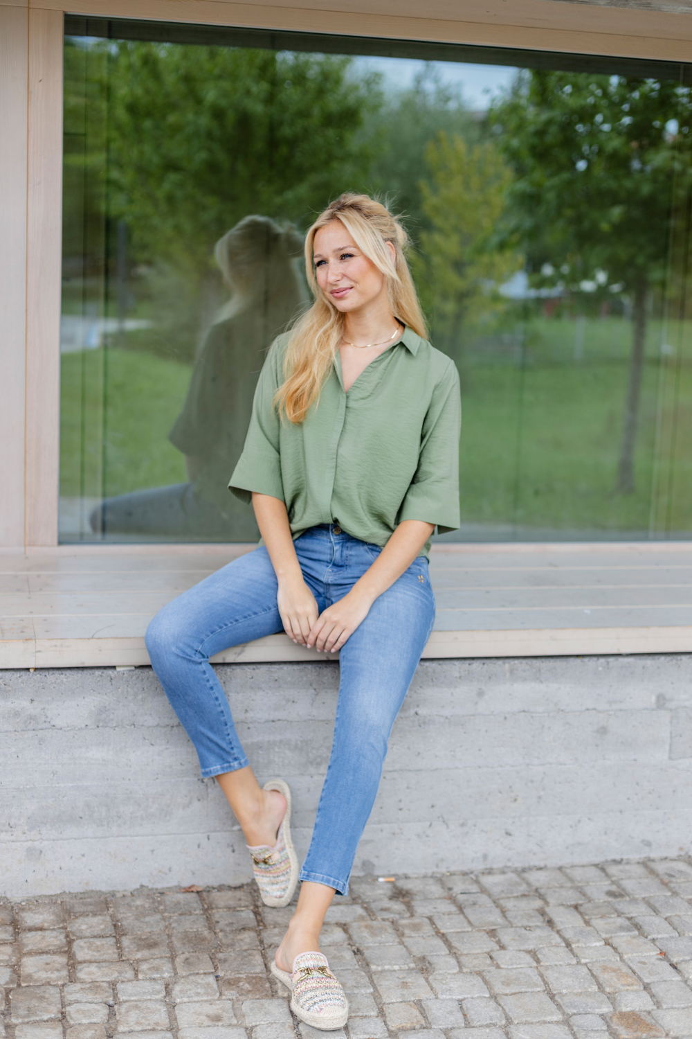 Women's blue slim fit jeans with low rise and cuffed hems
