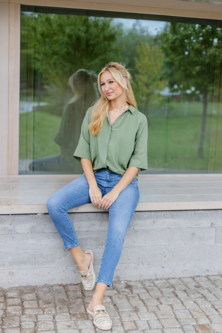 Women's blue slim fit jeans with low rise and cuffed hems