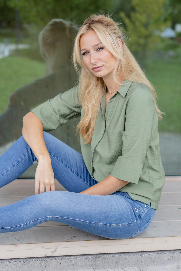 Women's blue slim fit jeans with low rise and cuffed hems