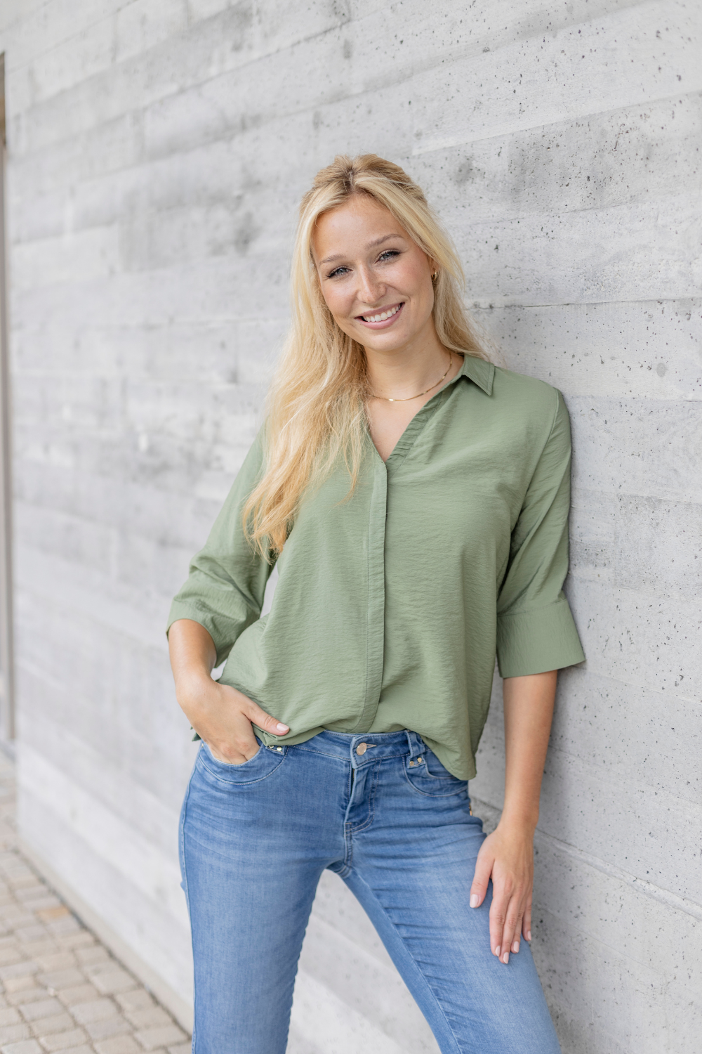 Women's blue slim fit jeans with low rise and cuffed hems