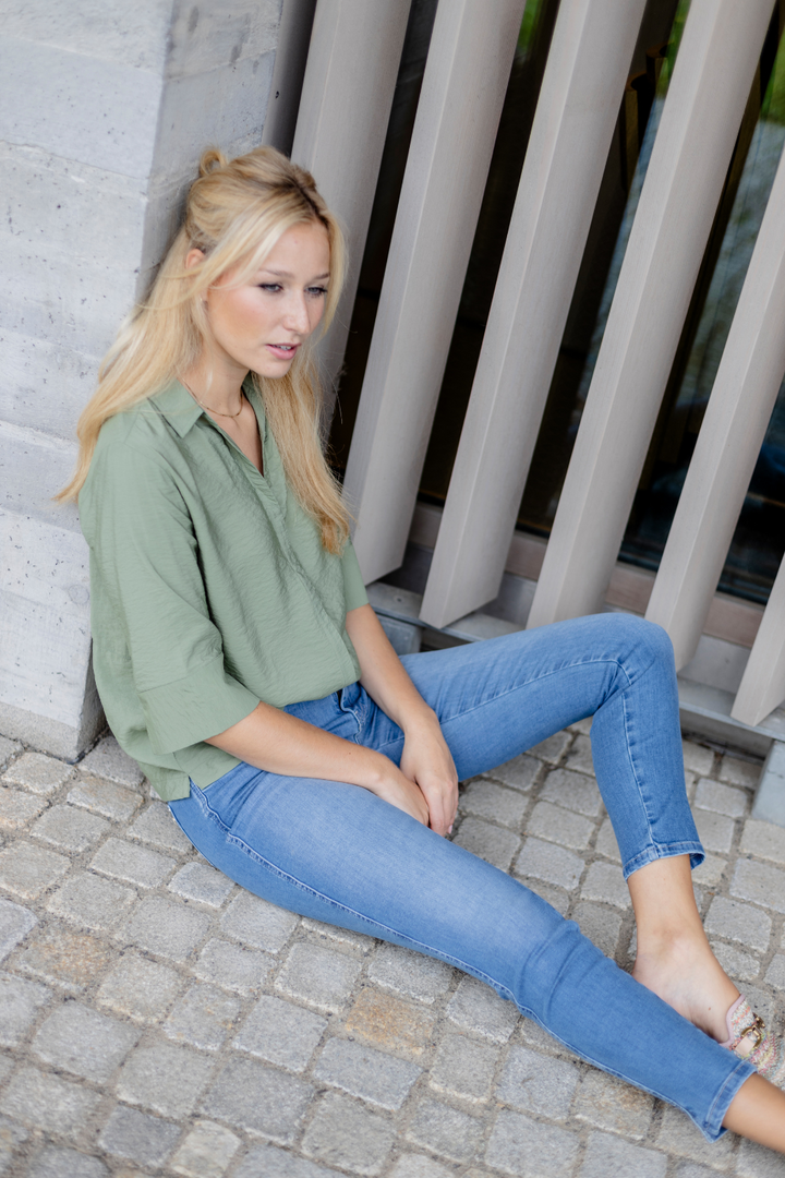 Women's blue slim fit jeans with low rise and cuffed hems