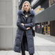 Women's long padded hooded coat with faux fur trim
