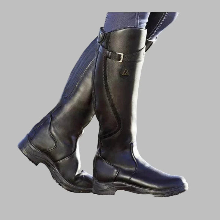 Women's tall riding boots with buckle strap and low heel