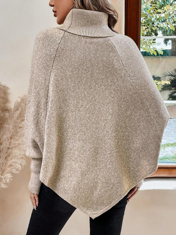 Women's cable knit poncho sweater with high neck, batwing sleeves and asymmetric hem