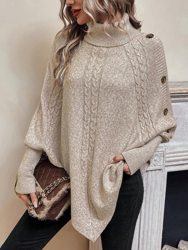 Women's cable knit poncho sweater with high neck, batwing sleeves and asymmetric hem