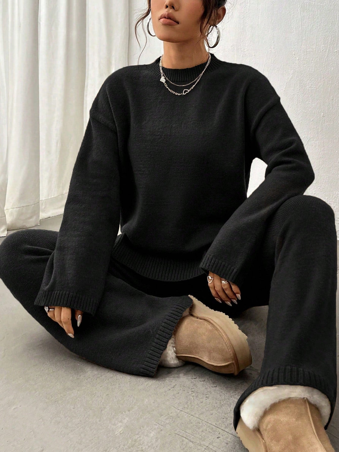 Women's knitted crew-neck sweater and matching trousers set