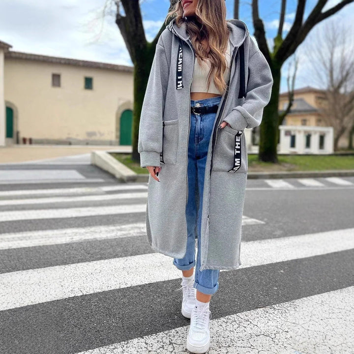 Women's long hooded coat with front zipper, patch pockets and contrasting trim
