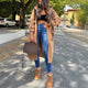 Women's long hooded coat with front zipper, patch pockets and contrasting trim
