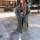 Women's long hooded coat with front zipper, patch pockets and contrasting trim
