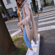 Women's long hooded coat with front zipper, patch pockets and contrasting trim