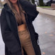 Women's long hooded coat with front zipper, patch pockets and contrasting trim