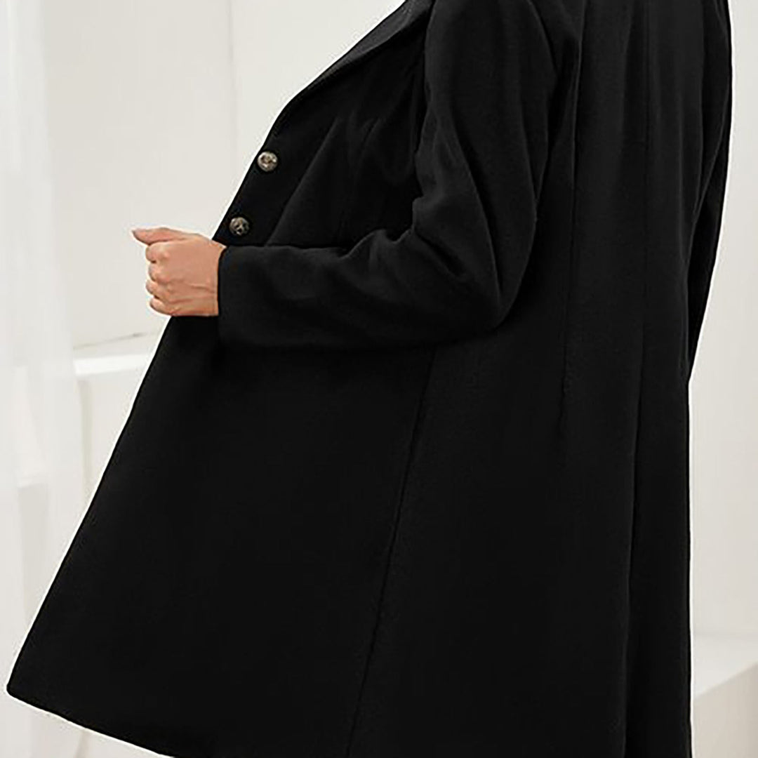 Women's long tailored coat with notched lapels and button front