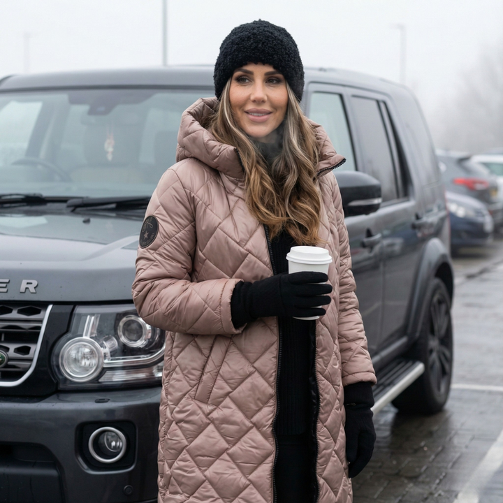 Women's quilted hooded long coat shown in pink and black