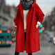 Women's hooded longline rain coat with button front and gathered cuffs