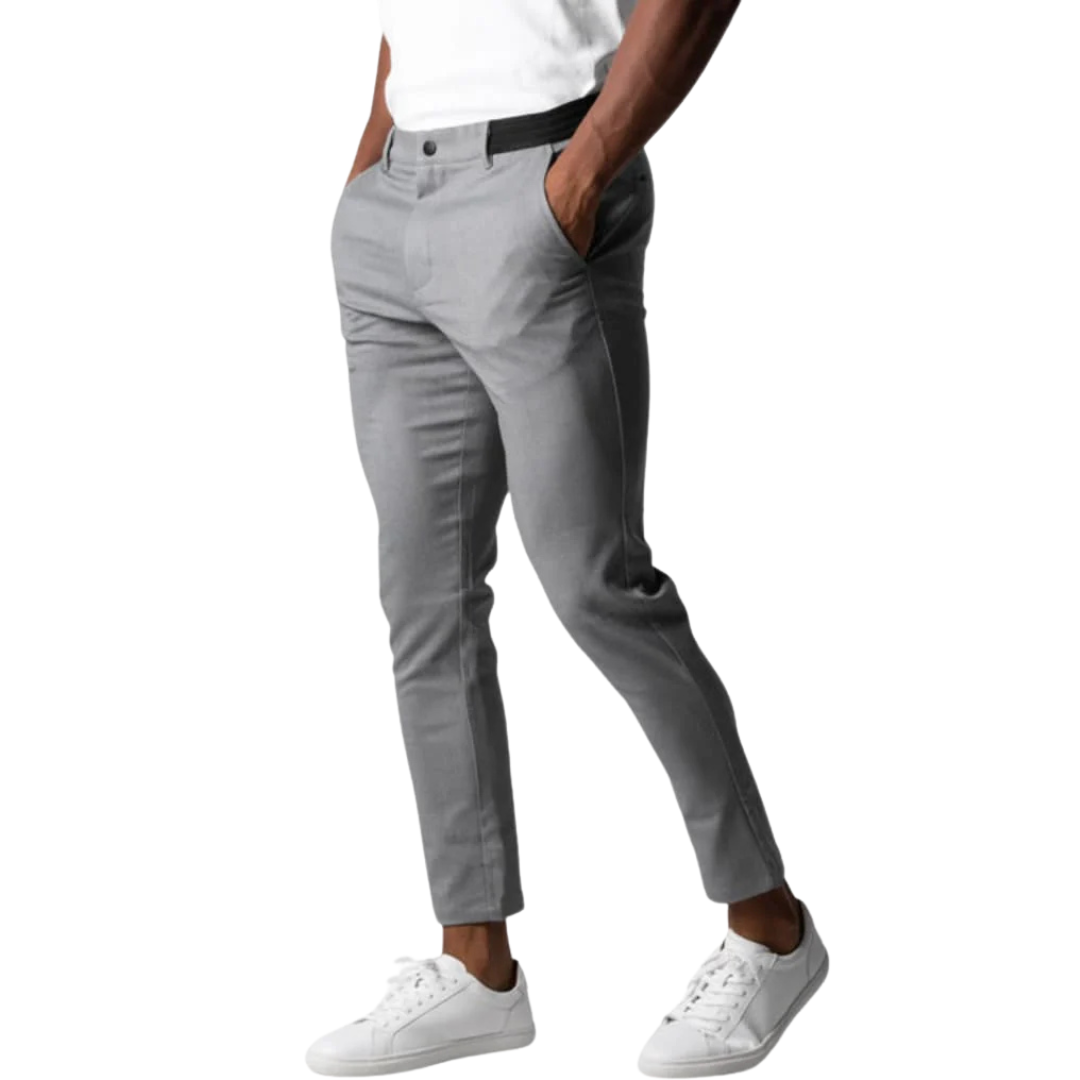 Men's slim tapered chino trousers shown in black and navy with button waist and ankle-length legs