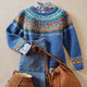 Women's blue geometric knit sweater with crew neck and long sleeves
