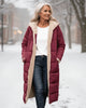 Women's long reversible quilted coat with contrasting trim and hooded collar