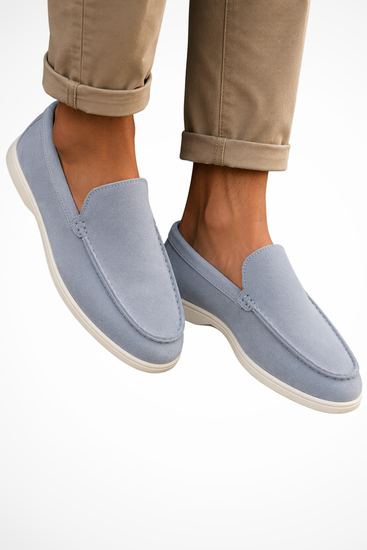 Men's slip-on loafers with rounded moc toe stitching and flat white soles