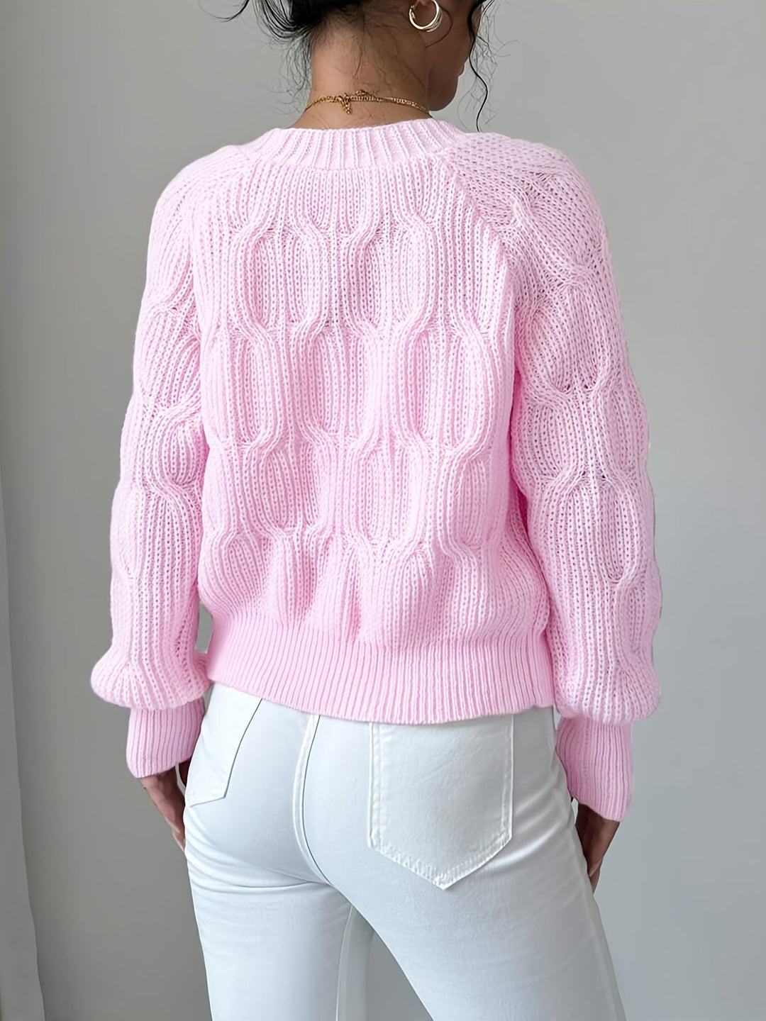 Women's ribbed V-neck cardigan with bow details and button front