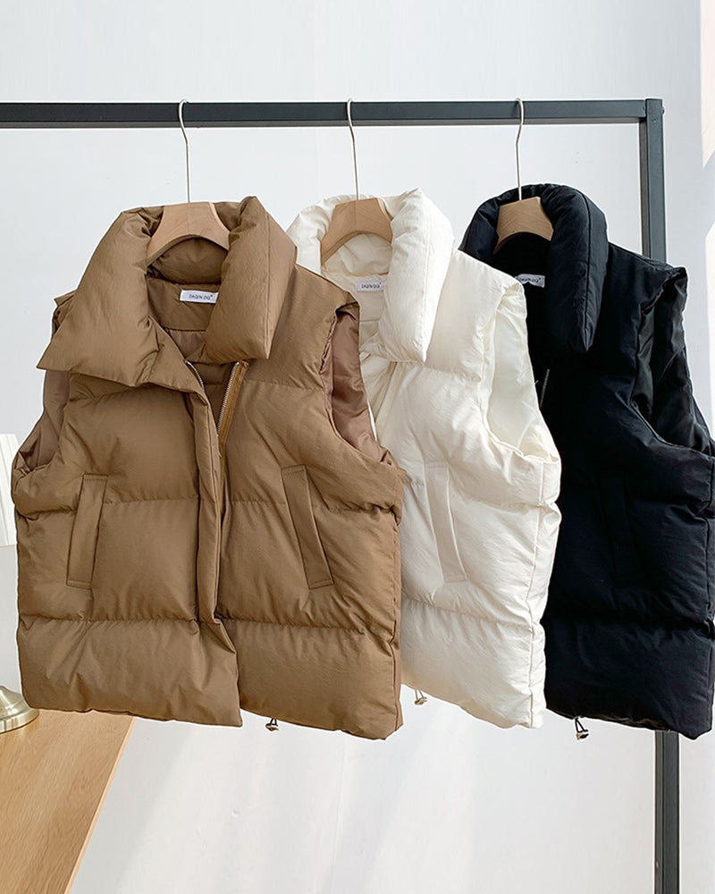 Sleeveless quilted puffer vest with stand collar, front zipper and side pockets