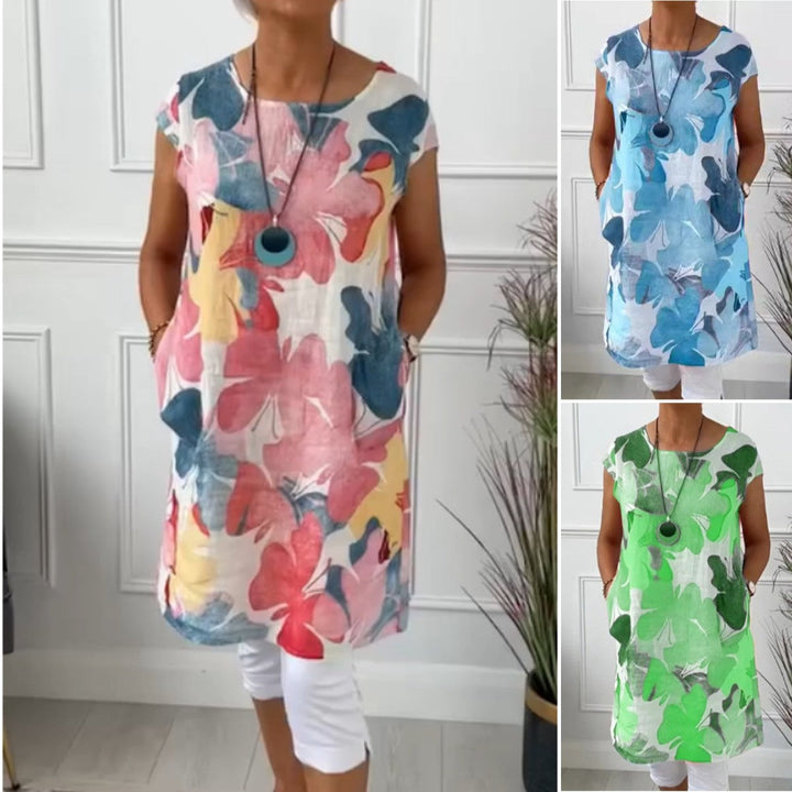 Women's floral print shift dress with short sleeves, crew neck and mid-calf hem