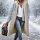 Women's long quilted hooded coat with plush trim